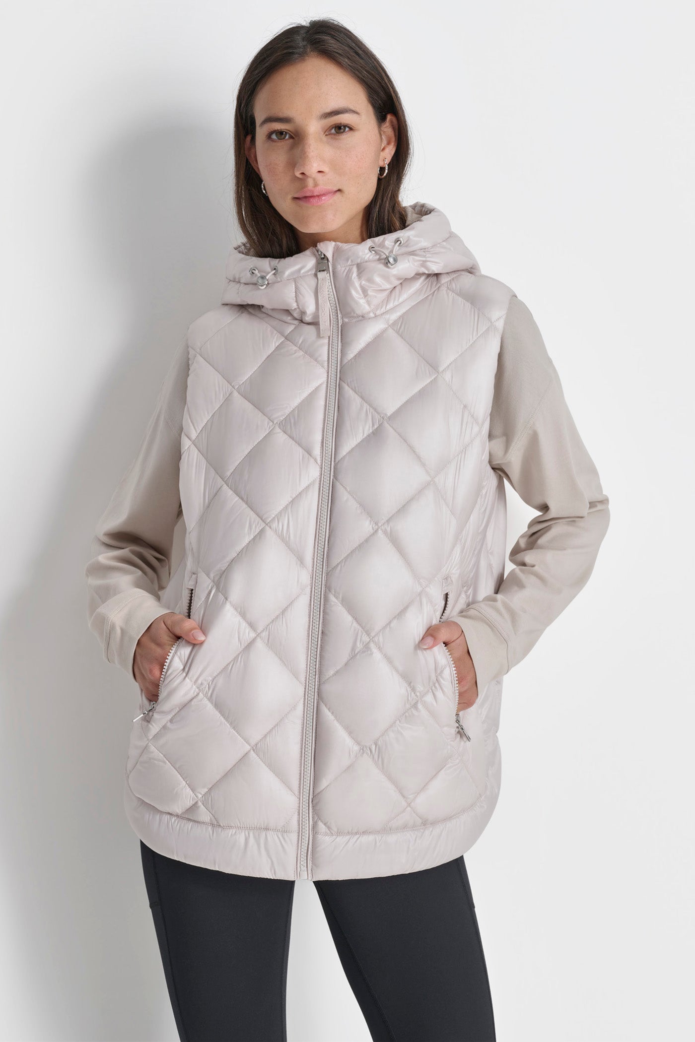 SLEEVELESS QUILTED CURVED HEM PUFFER VEST WITH HOOD DKNY Saudi Arabia Official Store